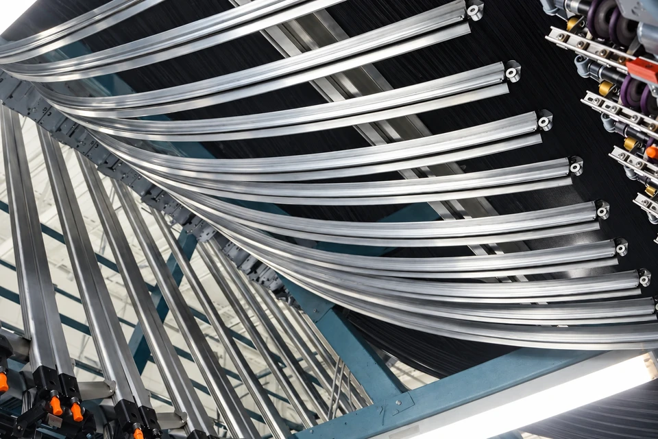 Curved HE cooling tracks installed across a Barmag AFK machine