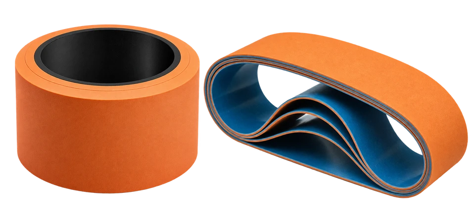 Orange rubber nip roller and orange apron belt with a blue inner surface
